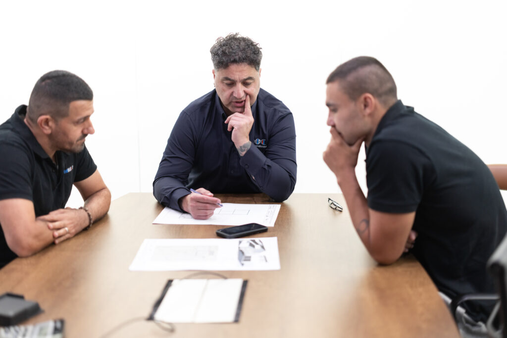 James Marroun from TLH Group collaborates with team members during a strategic planning meeting.